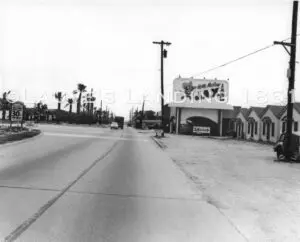 A road leading to the town in black and white image