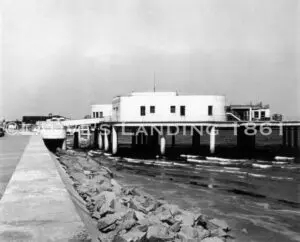 An old black and white photo of a pier.